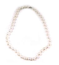 A pearl necklace, with white lustre finish beads, on a knotted string strand, of varying sizes, the