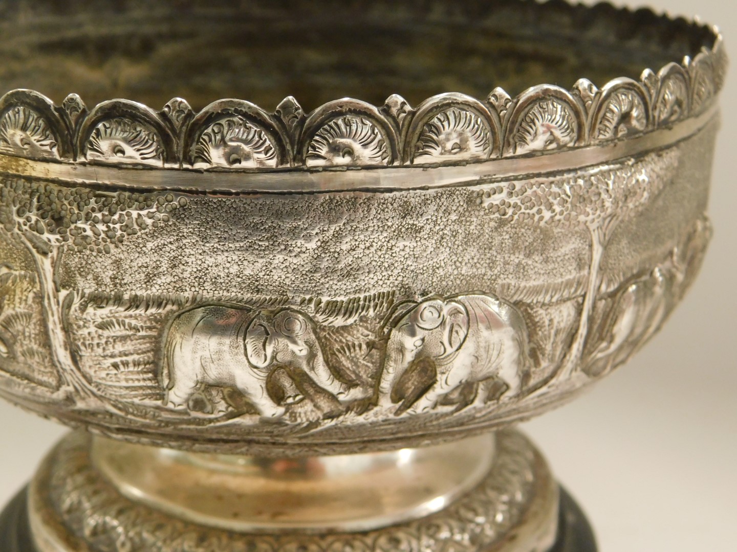 An Indonesian white metal bowl, with hammered safari scene body, on a stepped and ribbed foot, with - Image 4 of 4