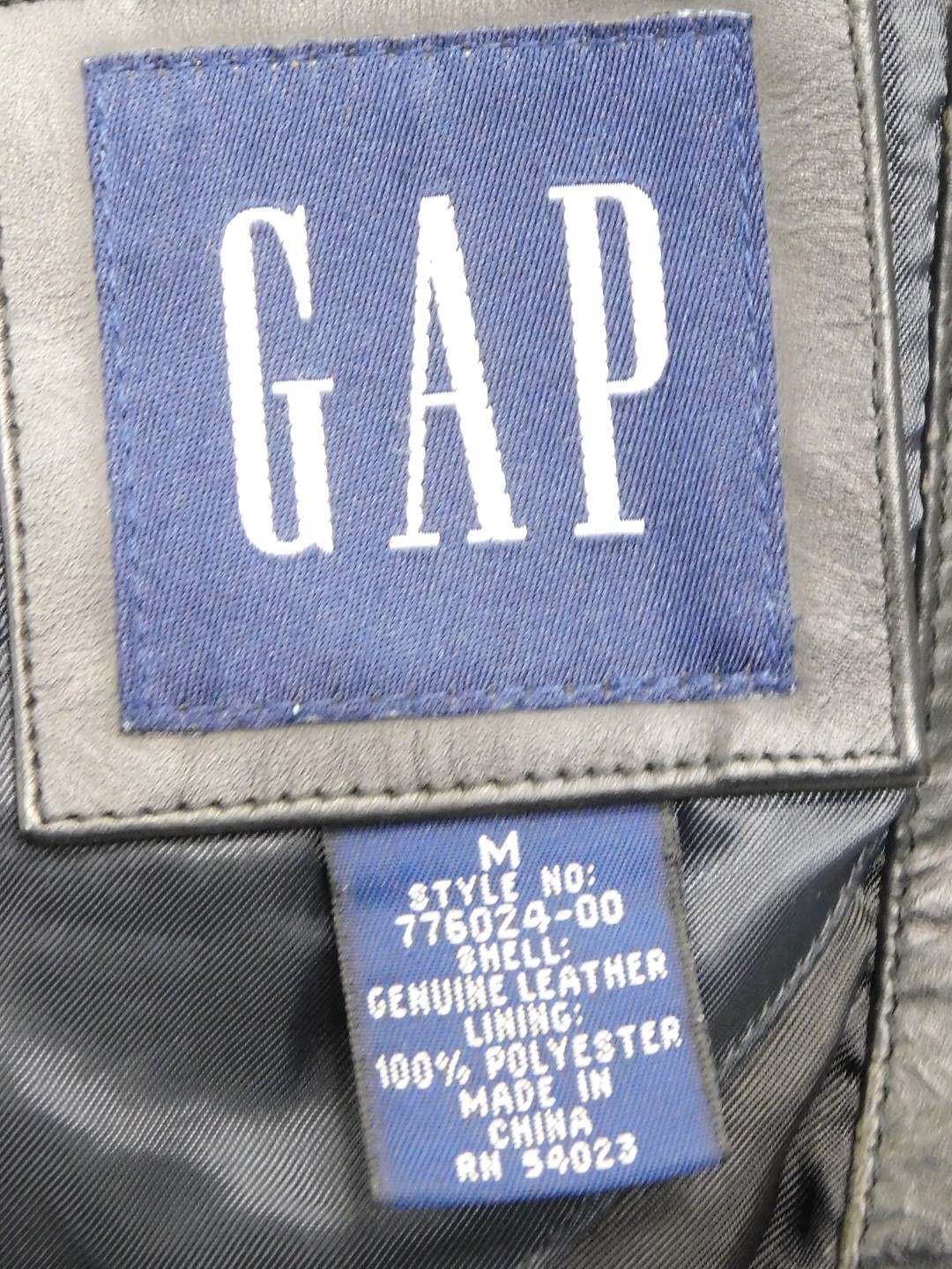 A GAP black leather jacket, size medium, and a Carlo Santini black leather jacket, size 40. (2) - Image 2 of 4