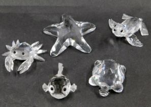 Five Swarovski crystal sea creatures, comprising crab 4cm wide, starfish 5.5cm wide, puffer fish 2cm