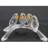 A Swarovski crystal figure group, of four parakeets on perch, each with an orange and yellow crystal