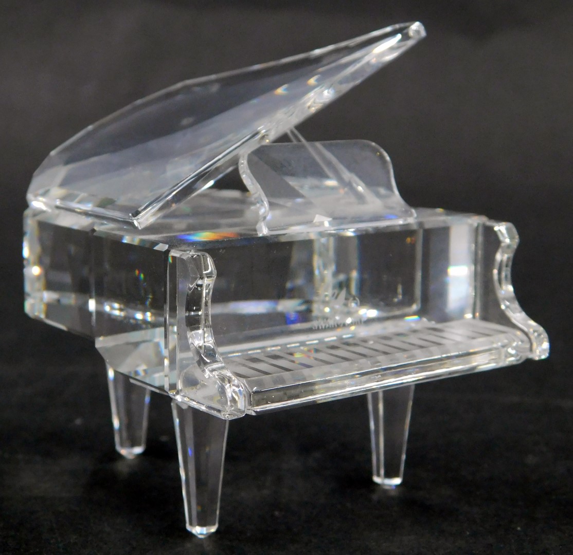 A Swarovski crystal grand piano, 6cm high, boxed.