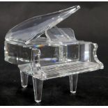A Swarovski crystal grand piano, 6cm high, boxed.
