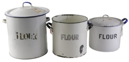 Three 20thC enamel circular flour bins, 30cm diameter, 23cm diameter, and various lids. (3)