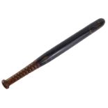 A Victorian ebonised police truncheon, numbered 180, 45cm long.