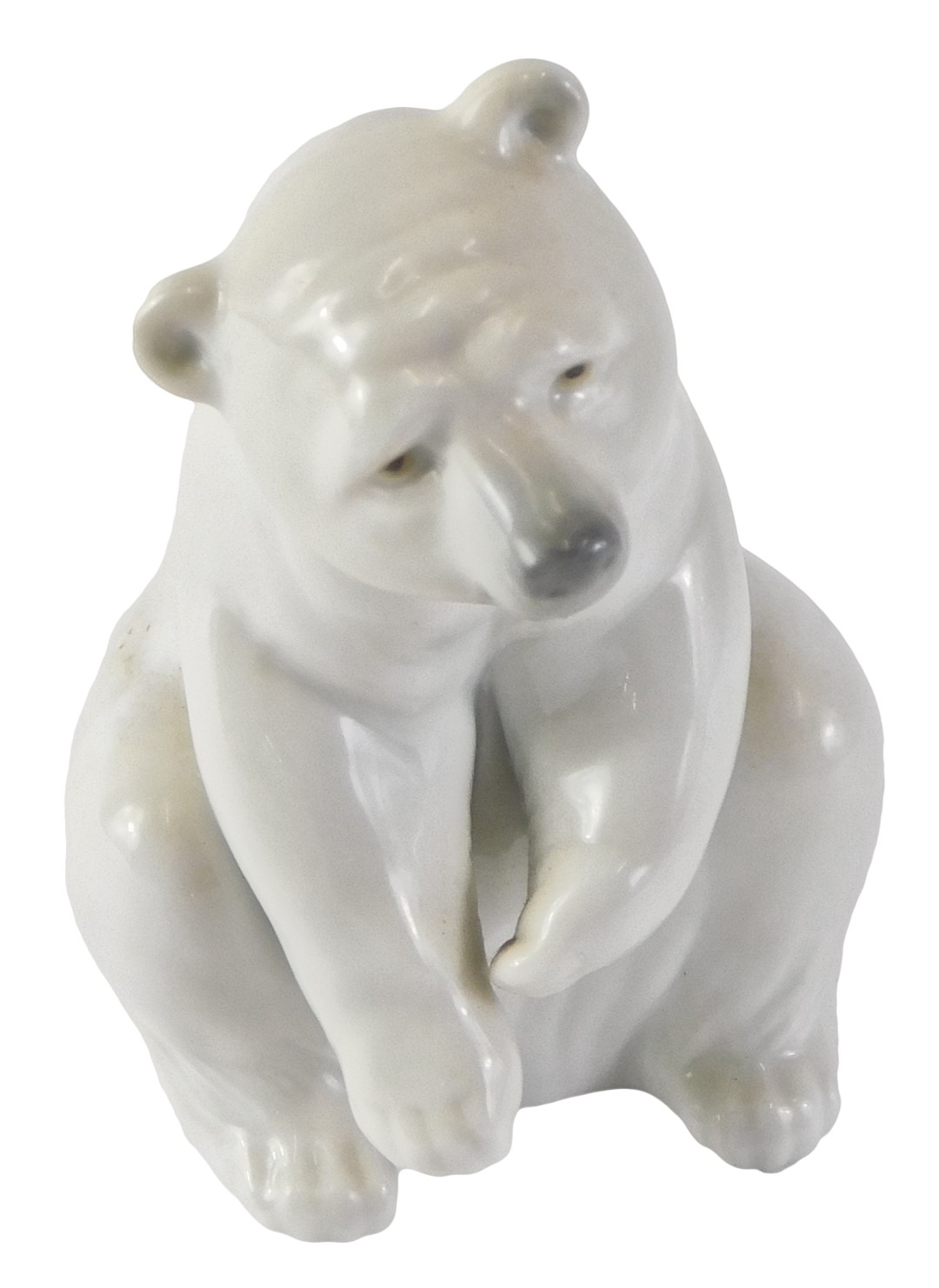 A Lladro figure of a seated polar bear, with blue stamp to underside, 13cm high, boxed.