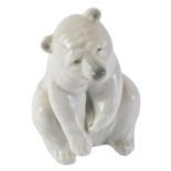 A Lladro figure of a seated polar bear, with blue stamp to underside, 13cm high, boxed.