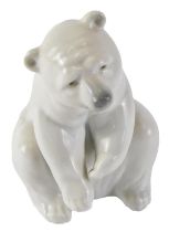 A Lladro figure of a seated polar bear, with blue stamp to underside, 13cm high, boxed.