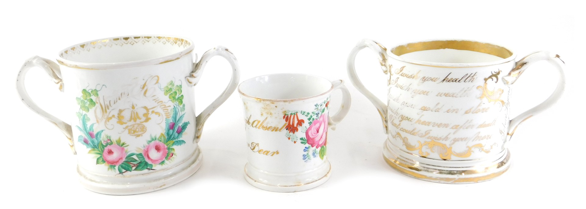 A 19thC Staffordshire loving cup, with indistinct name, dated 1862, 22cm wide, another similar, pain
