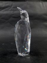 A Swarovski crystal figure of a penguin, 13cm high, boxed with certificate.