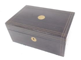 A Victorian ebonised and brass inlaid writing box, the hinged top with vacant flower head shaped car