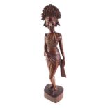 A Balinese hardwood carving of a female figure, 51cm high.