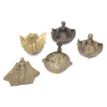 Five various early 20thC cast brass novelty ashtrays, to include three female figures, etc.