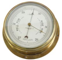 A Sestrel brass cased ship's barometer, stamped Sharman D Neill Limited Belfast, 26cm diameter.