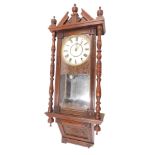 A 19thC American wall clock, with a painted dial, in carved walnut case, 106cm high. (AF)