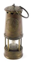 A Protector brass miner's lamp, type number 6, 23cm high.