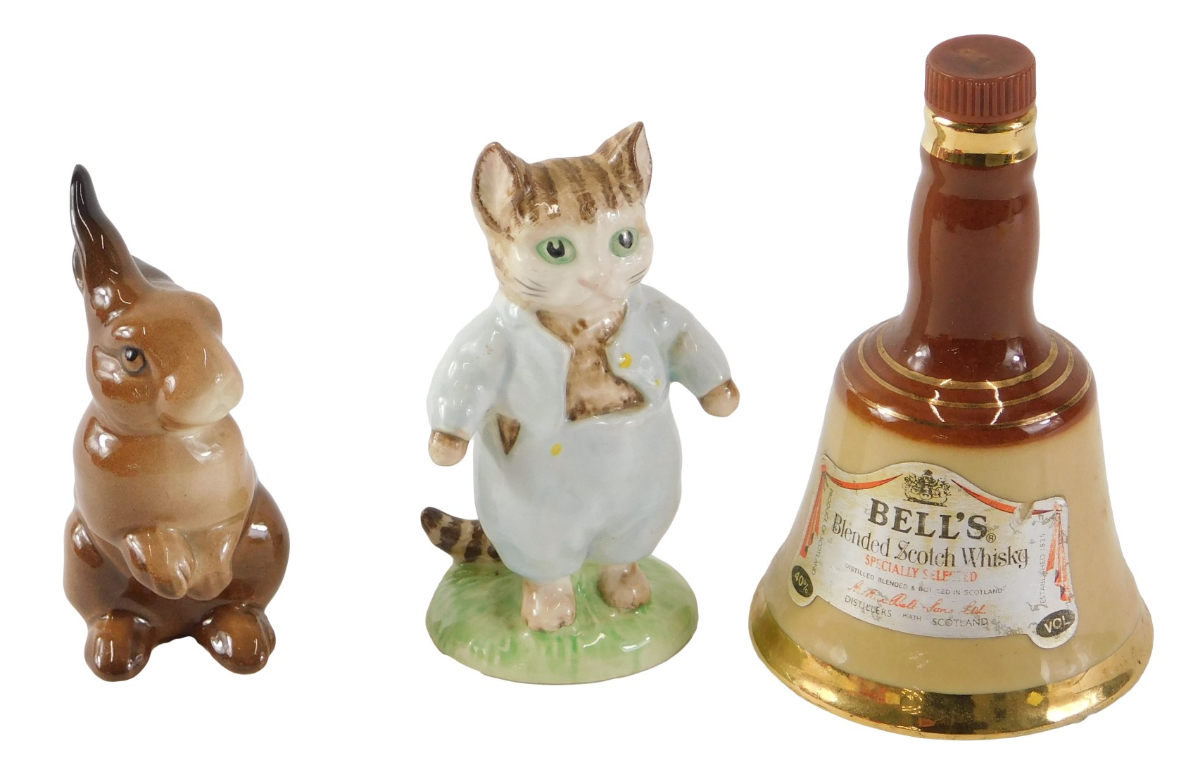 Collectables, comprising a Royal Albert Tom Kitten, a Wade seated rabbit, and a miniature Bell's whi