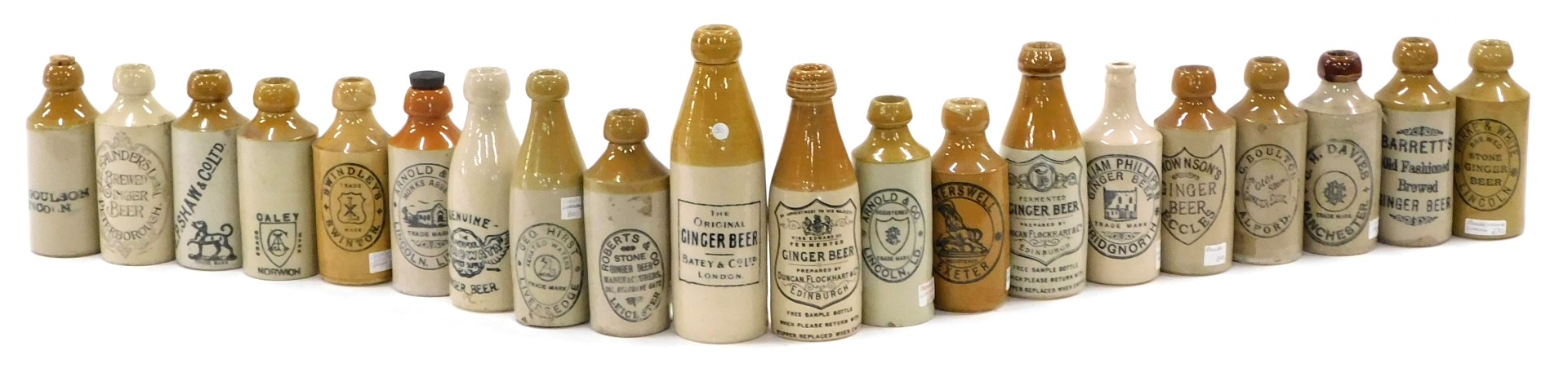 A collection of stoneware ginger beer bottles, various makers to include Lincolnshire.