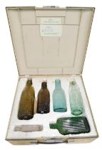 Six 19thC glass bottles, comprising Whitworth & Sons of Wath, green glass bottles, etc., in fitted c