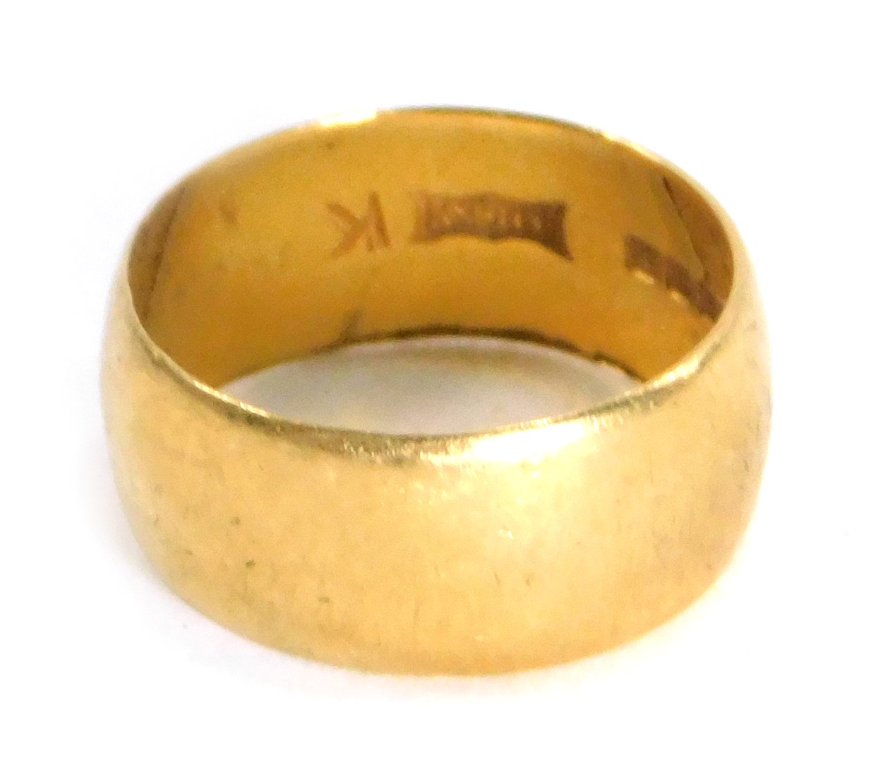 A 22ct gold wedding band, of plain design inscribed 'Lucky', Birmingham 1968, ring size J, 3.7g.