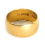 A 22ct gold wedding band, of plain design inscribed 'Lucky', Birmingham 1968, ring size J, 3.7g.
