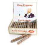 A box set of King Edward Invincible Deluxe cigars, enclosing twenty nine cigars, in opened box.