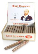 A box set of King Edward Invincible Deluxe cigars, enclosing twenty nine cigars, in opened box.