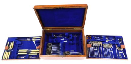 A canteen of Old English pattern silver plated cutlery, in an oak case with brass handles.