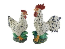 A pair of ceramic cockerels, 32cm high.