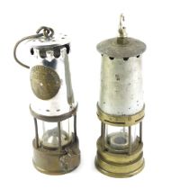 Two miner's lamps, comprising one Protector Lamp and Lighting Company, type 6 number 2, with swing h