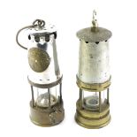 Two miner's lamps, comprising one Protector Lamp and Lighting Company, type 6 number 2, with swing h