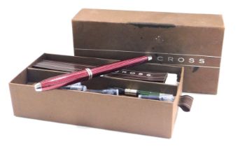 A Cross fountain pen, in red striped case, with nib stamped 750, cased with additional inks, model 3