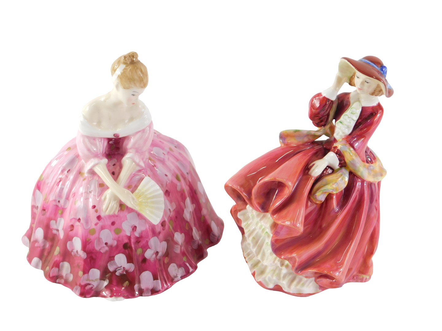 Two Royal Doulton figurines, Top o' the Hill, and Victoria.