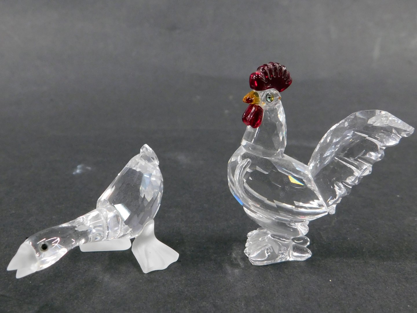 A Swarovski crystal cockerel, with coloured crystal mane, 4cm high, and a seated shouting goose, 4cm