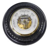 A late 19th/early 20thC ebonised aneroid barometer, with circular case, 21cm diameter.