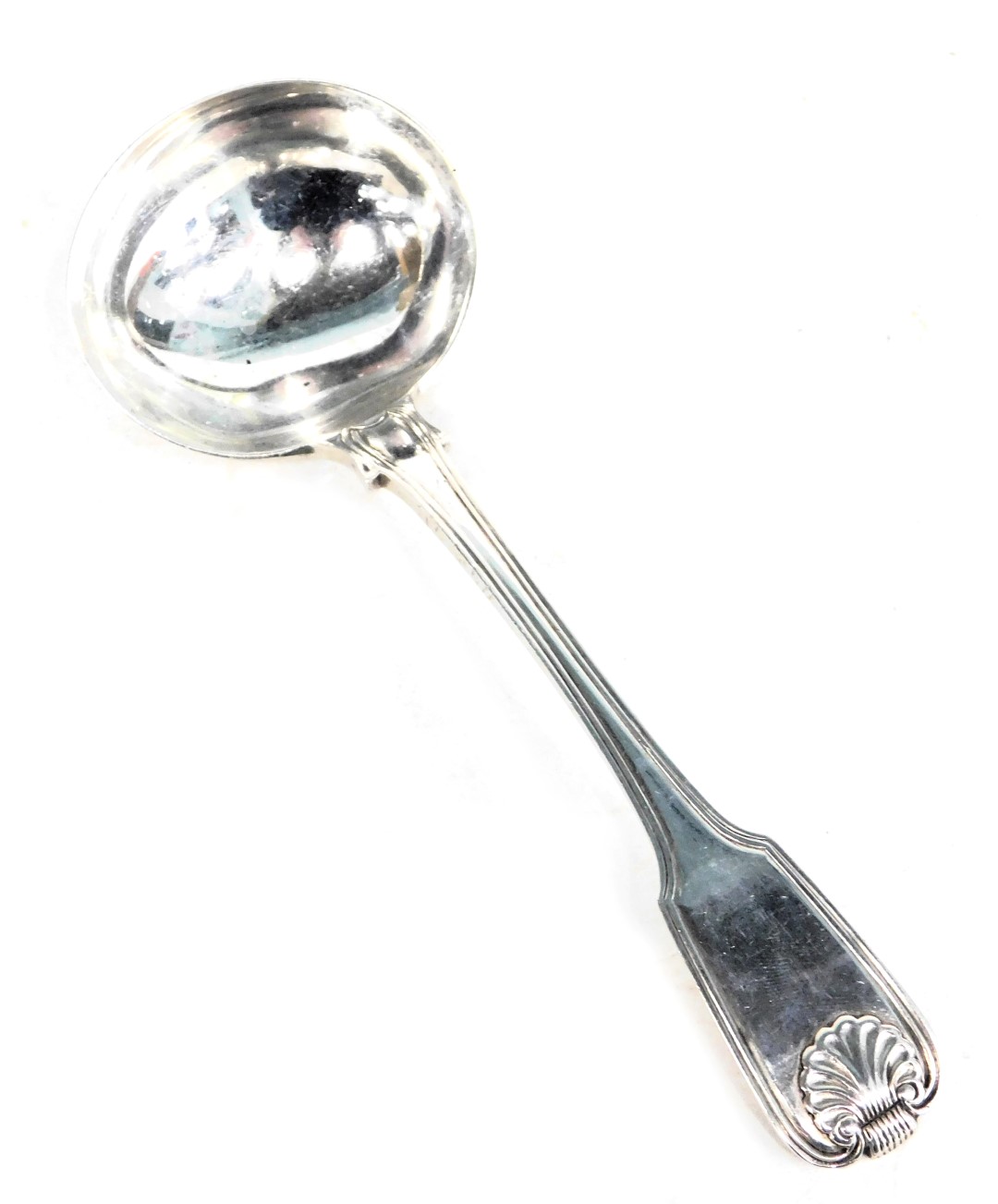 A white metal toddy ladle, shell patterned and reeded top, maker T&Co bearing lion crest, hallmarks
