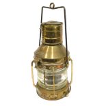 A late brass ship's lamp, with label Anchor.
