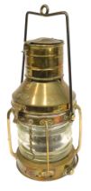 A late brass ship's lamp, with label Anchor.