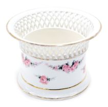 A Continental porcelain basket, with lattice border, and transfer printed decoration of roses, numbe