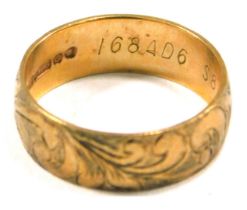 A 9ct rose gold wedding band, of floral scroll design, maker BW & S, London 1949, ring size J½, 2.6g