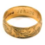 A 9ct rose gold wedding band, of floral scroll design, maker BW & S, London 1949, ring size J½, 2.6g