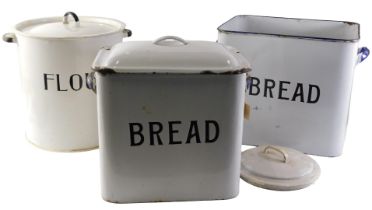 Two rectangular enamel bread bins, each on a white ground with blue border, with lids, 32cm and 31cm