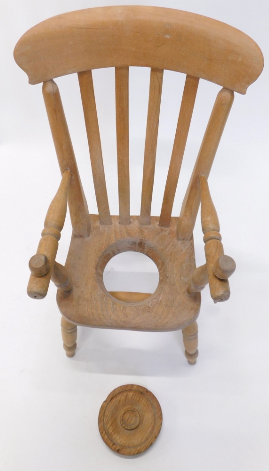 A child's commode chair, with slatted back, covered recess to elm seat, on turned legs with H stretc - Image 2 of 2