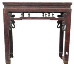 A Chinese red stained altar table, with a pierced frieze and shaped legs, 84cm high, 89cm wide.