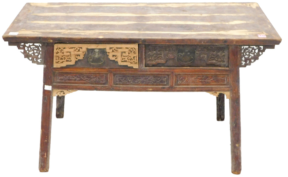 A Chinese red stained altar table, the planked top above two frieze drawers, with brass handles, fla