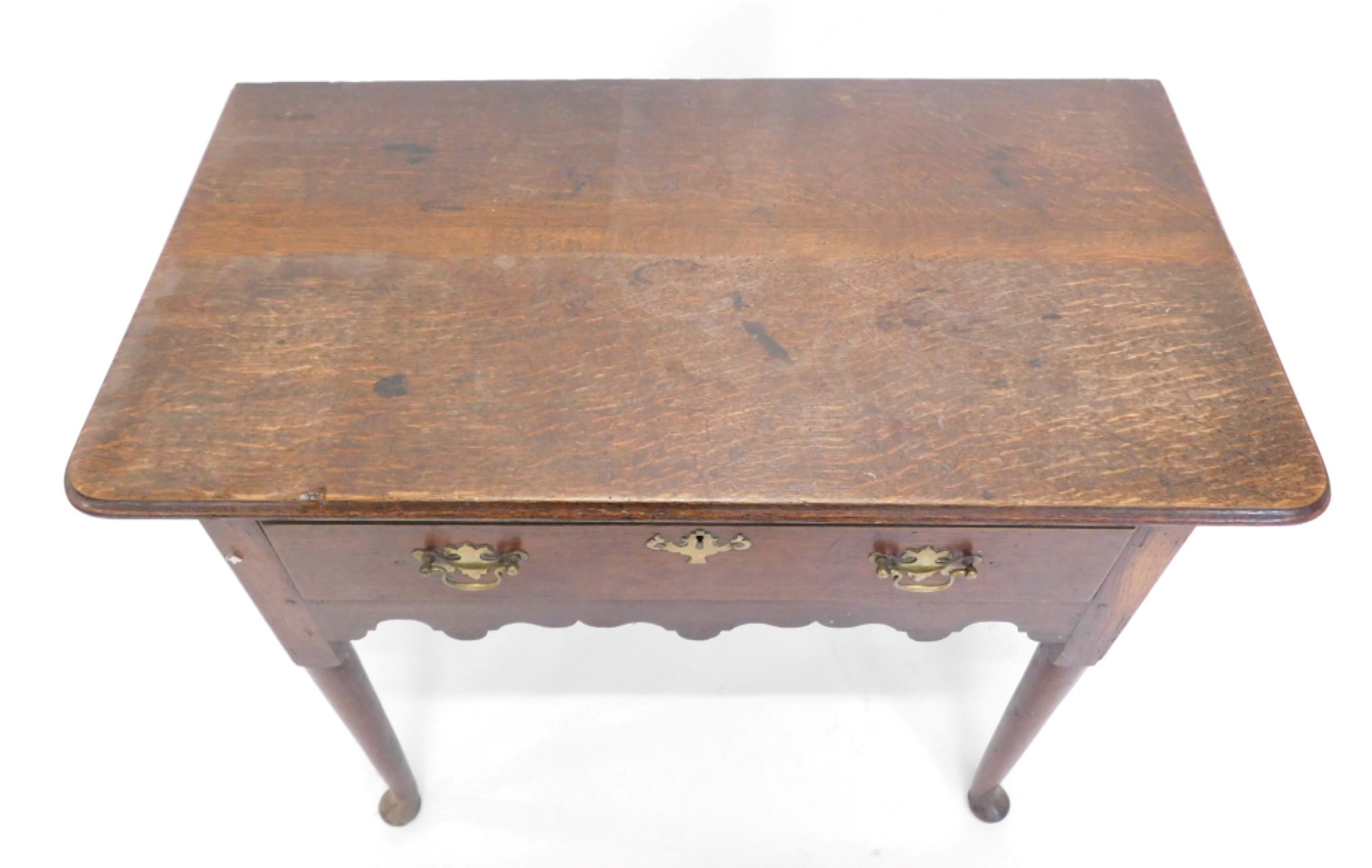 An 18thC oak low boy, the rectangular top with rounded corners and a moulded edge, above a frieze dr - Image 2 of 2