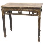 A Chinese elm altar table, with a pierced frieze, on shaped legs, 85cm high, 95cm wide.