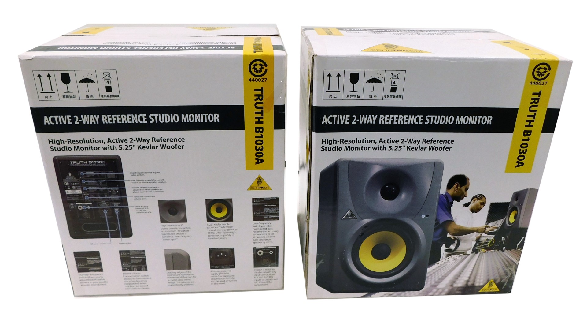 Two Behringer active 2-way reference studio monitors, boxed.
