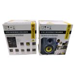 Two Behringer active 2-way reference studio monitors, boxed.