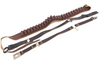 A brown leather cartridge belt, a Girl Guide Association belt, and a boy scout leather belt. (3)